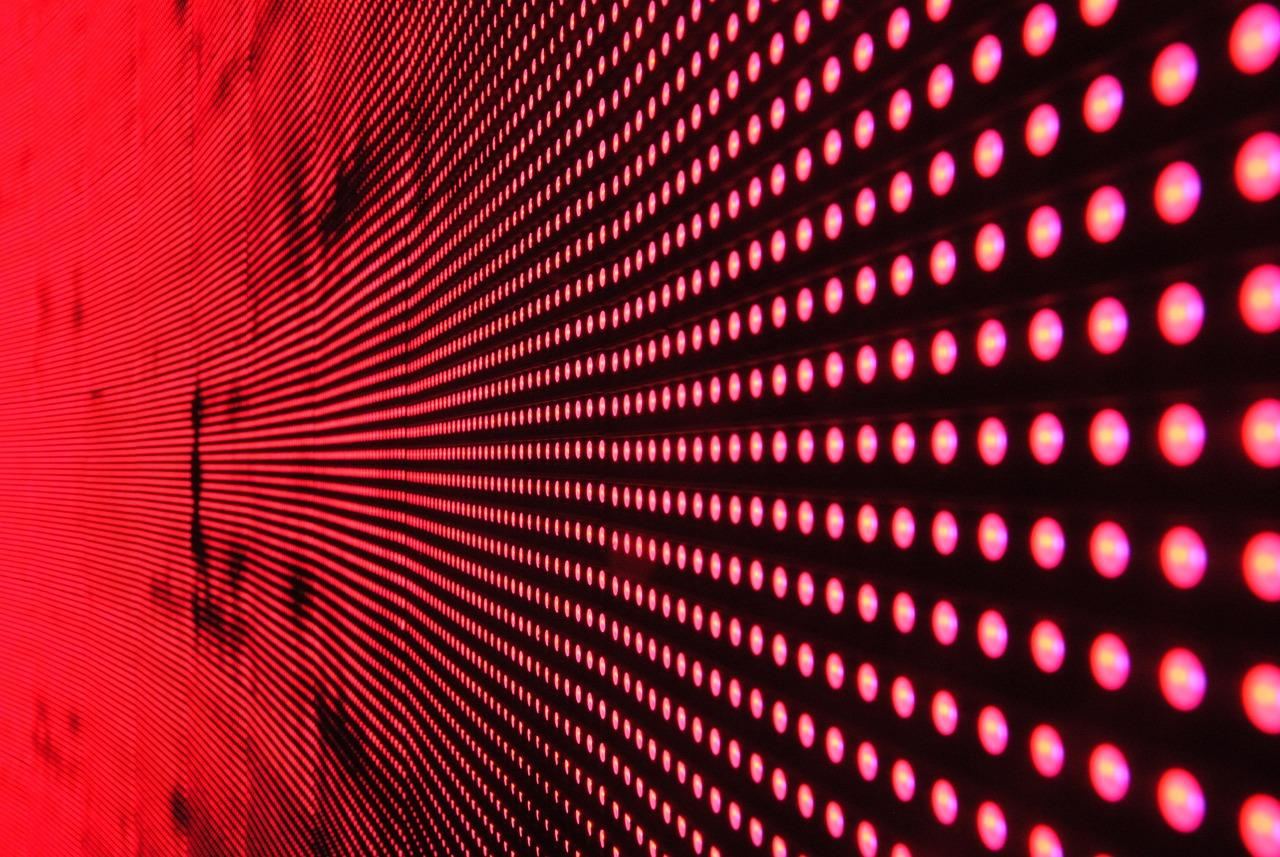 Ilustración abstracta de una matriz de luces LED, representando conceptualmente la densidad de miles de LEDs microscópicos que forman la retroiluminación de un panel Mini-LED.